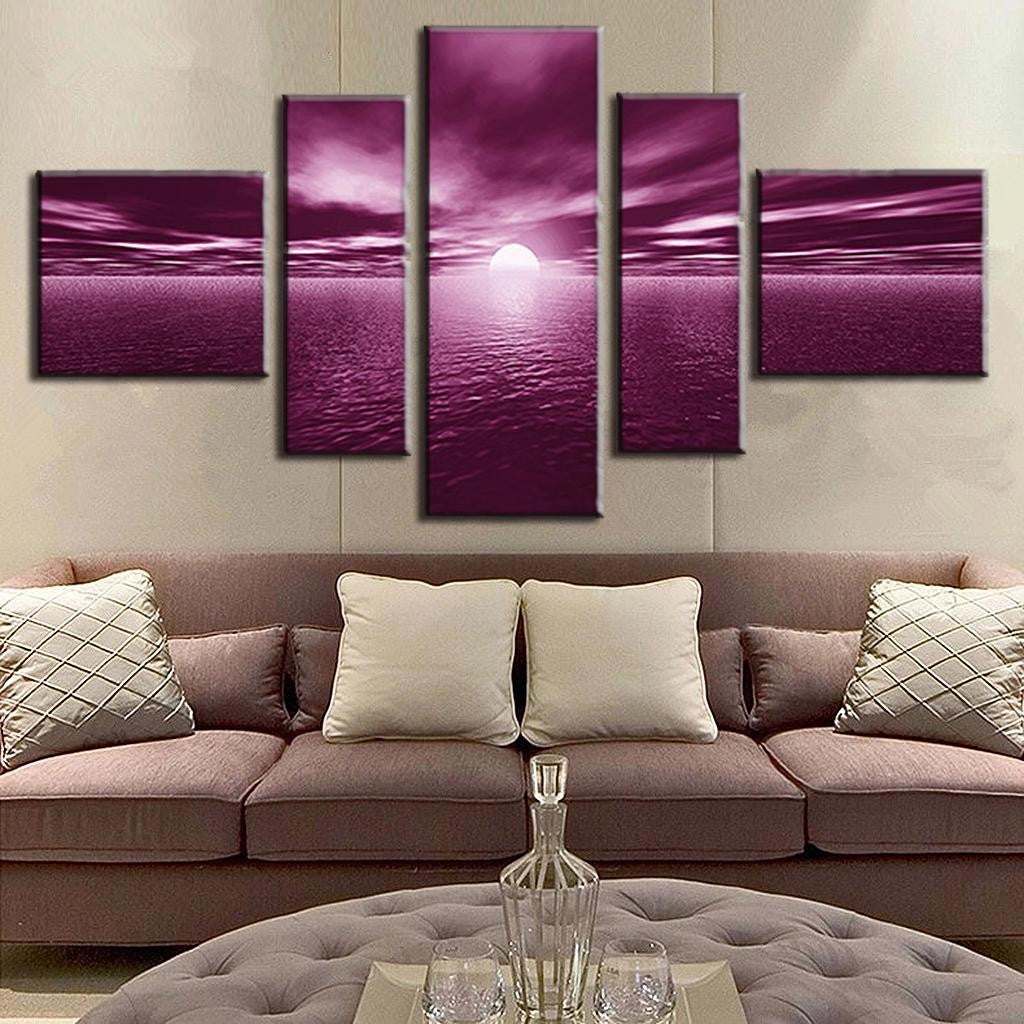 Plum Sunset over Water: 5-panel canvas wall art displaying a dramatic purple sunset with bright sun setting over rippling water, creating a serene and ethereal seascape with vibrant magenta clouds stretching across the horizon