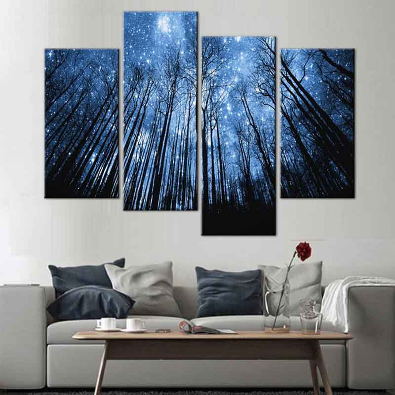 Blue Forest with Starry Sky canvas wall art featuring tall dark tree silhouettes against a mystical night sky filled with twinkling stars, split across 4 panels for dramatic home decor impact