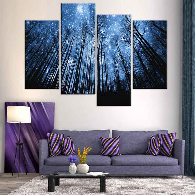 Blue Forest with Starry Sky: Enchanting 4-panel canvas art featuring tall silhouetted trees reaching towards a luminous night sky filled with twinkling stars and moonlight, creating a mystical woodland atmosphere