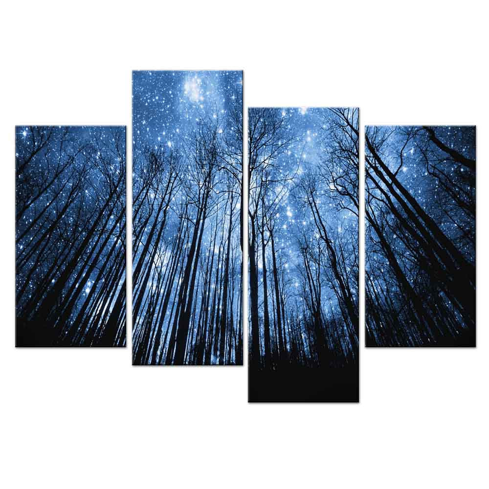 Blue Forest with Starry Sky - 4 panel canvas wall art featuring tall silhouetted trees against a mystical night sky filled with bright stars and moonlight, creating a dramatic upward perspective in deep blue tones