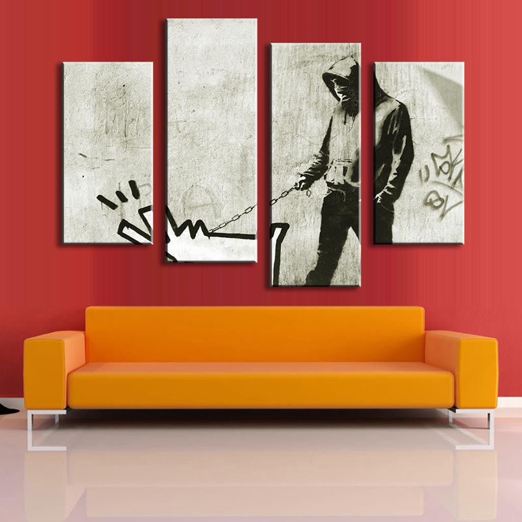 Walk the Dog Banksy print showing urban street art on 4 canvas panels depicting a figure walking a barking cartoon dog, displayed above orange sofa against red wall