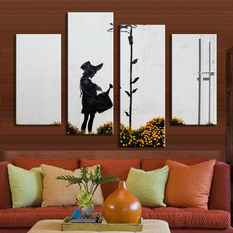 The Girl is Watering - Banksy wall art featuring black and white silhouette on white background, 4-panel canvas print with yellow flowers, urban street art style depicting figure watering tall plant, modern home decor