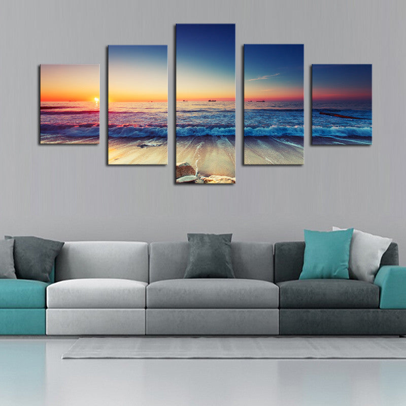 Waves and Sunset Scene - 5-panel canvas wall art displaying vibrant ocean waves crashing on beach during sunset with orange and blue gradient sky, perfect coastal home decor piece measuring 60x32 inches
