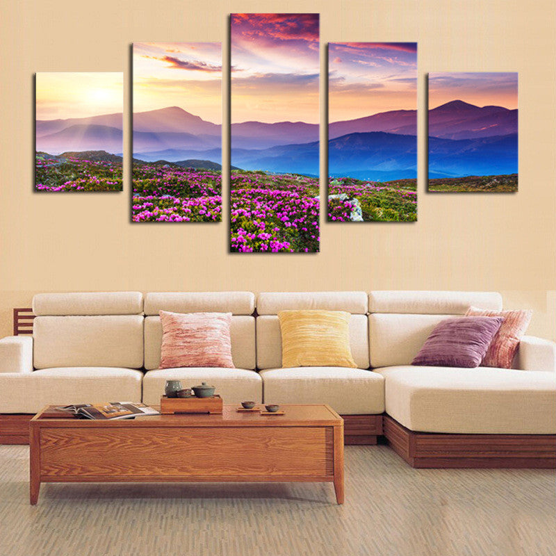 Mountainview Sunset canvas wall art displaying vibrant purple wildflowers in foreground with layered mountain silhouettes against pink and purple sky at dusk, creating a stunning 5-panel landscape composition