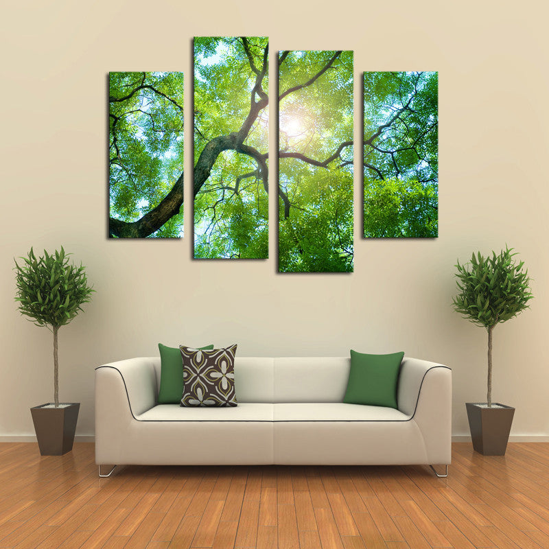 Sunlight Behind Tree - 4-panel canvas wall art showing bright sunlight filtering through lush green tree branches, creating a natural canopy viewed from below, perfect for modern home decor