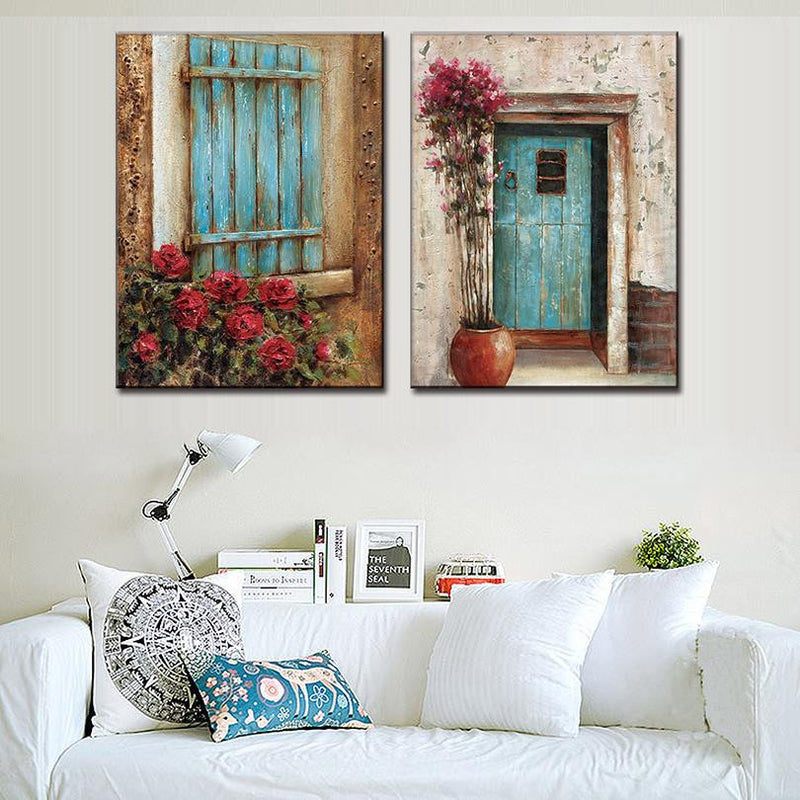 Abstract Window Door Design - Rustic wall art featuring two panels with turquoise wooden elements: a weathered shutter with red roses and a distressed door with pink climbing flowers in terra cotta pot, set against textured beige walls