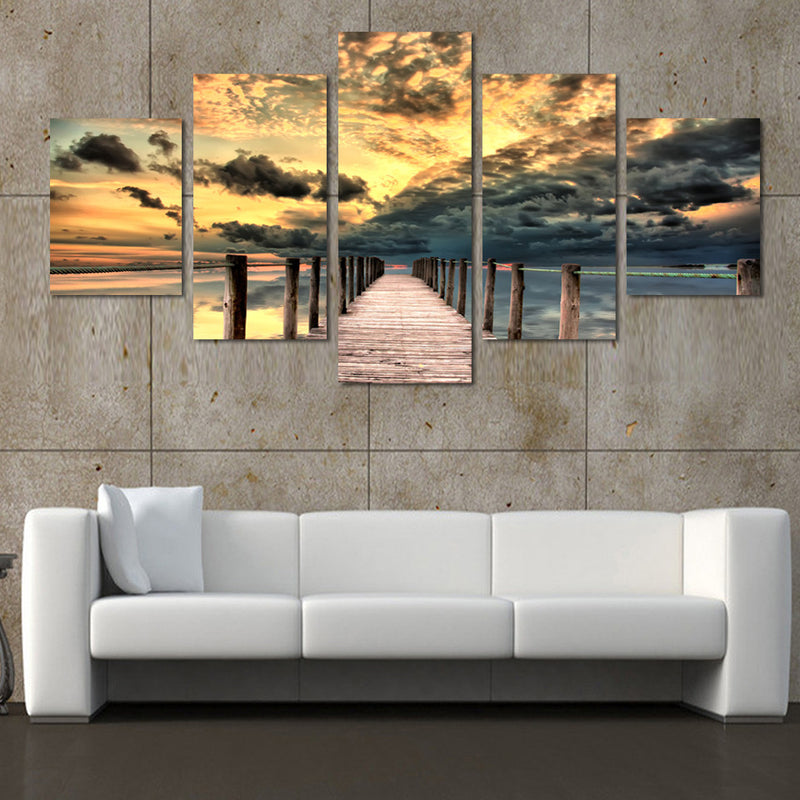 Dock and Seascape: Dramatic 5-panel canvas wall art featuring wooden pier extending into ocean at sunset, with golden clouds and stormy skies creating stunning coastal scene perfect for home decor