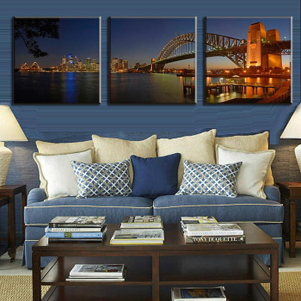 Sydney Harbour Bridge - Three-panel canvas wall art featuring a stunning nighttime panorama of Sydney Harbour, showcasing the illuminated bridge, Opera House, and city skyline reflected in calm waters