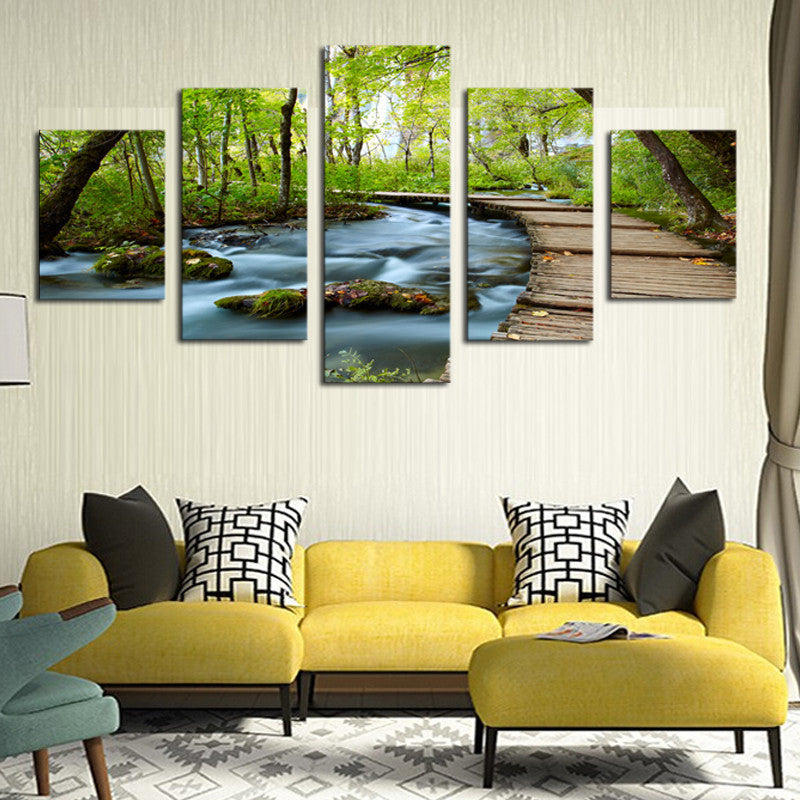 Woods and Waterfalls - 5-panel canvas wall art featuring a serene forest stream with wooden pathway, mossy rocks, and lush green trees creating a peaceful nature scene perfect for home decor